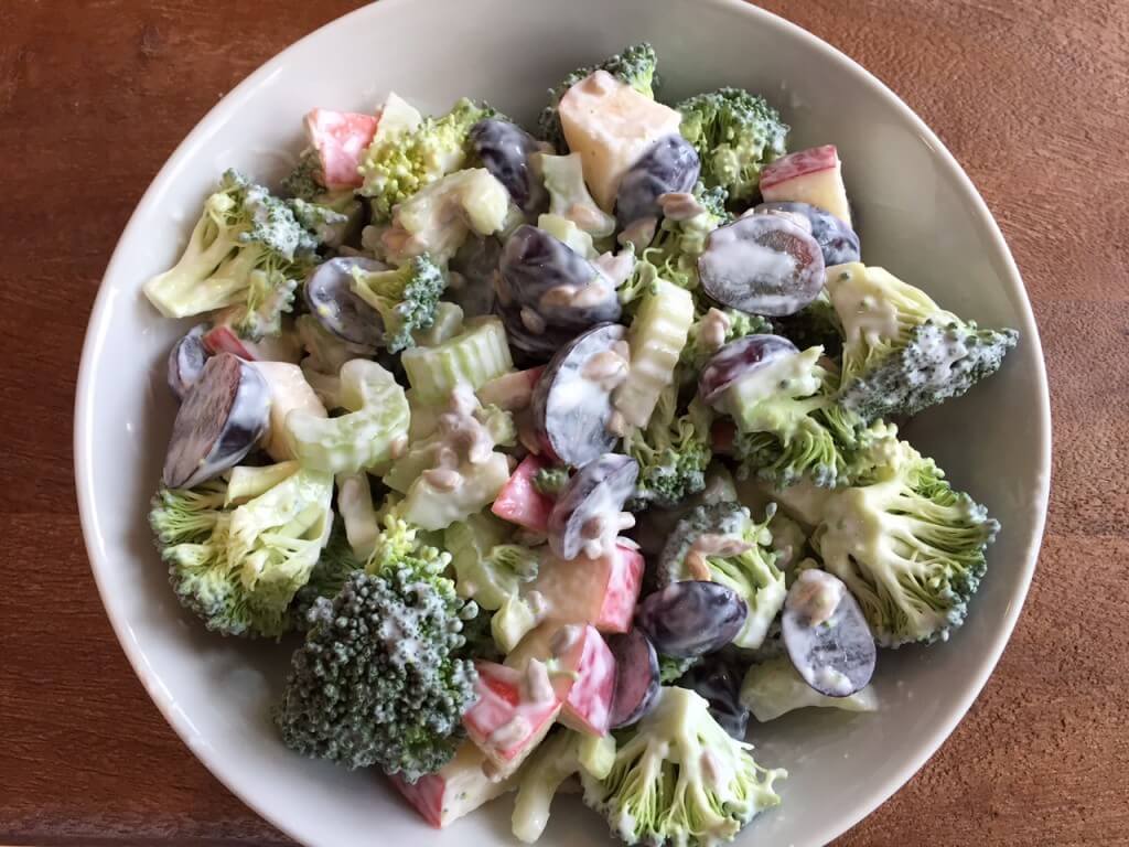 IMG_3500 - Mom to Mom Nutrition Traditional broccoli salad is made with fresh fruit, crunchy vegetables, and sunflower seeds and topped with a sweet and savory Greek yogurt dressing.