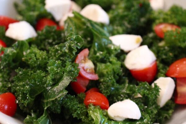 IMG_0426 - Mom to Mom Nutrition Kale Caprese Salad is a fresh take on the Italian classic, filled with kale, basil, tomatoes, mozzarella and a light vinaigrette.