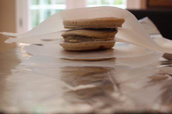 An easy and easy and healthy recipe for whole wheat oatmeal pancakes. Make a big batch, freeze, then reheat for busy mornings!