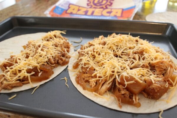 Fresh pineapple, BBQ sauce, and shredded chicken come together to make one easy weeknight meal with these Hawaiian BBQ Chicken Quesadillas. 