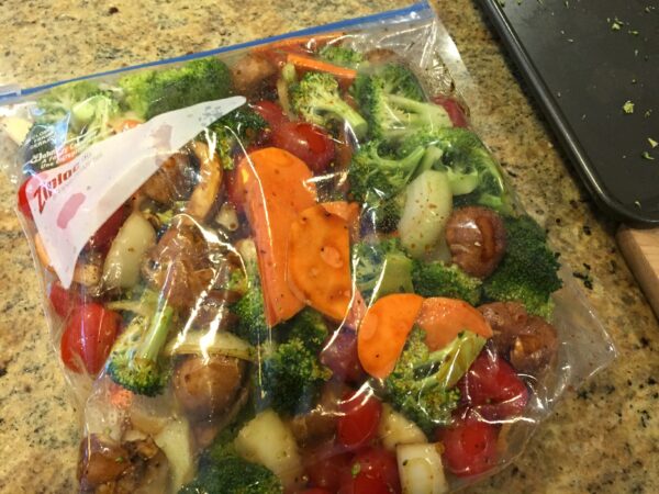 Whole garlic cloves and grated Parmesan cheese make these Garlic Roasted Potatoes a simple side dish the whole family will enjoy!