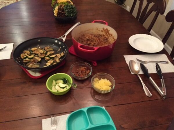 Learn how one Mom makes the most of childhood independence with the basics and benefits behind serving family style meals. 