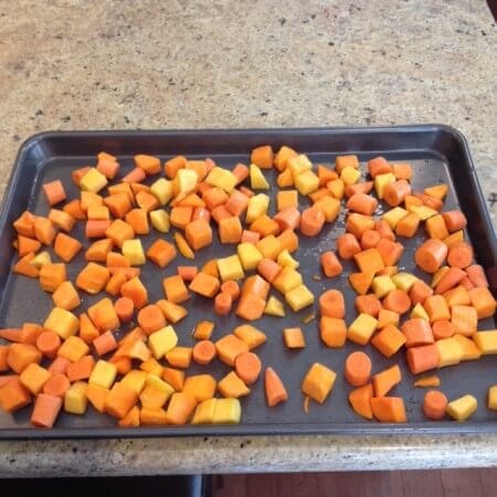 Whole garlic cloves and grated Parmesan cheese make these Garlic Roasted Potatoes a simple side dish the whole family will enjoy!