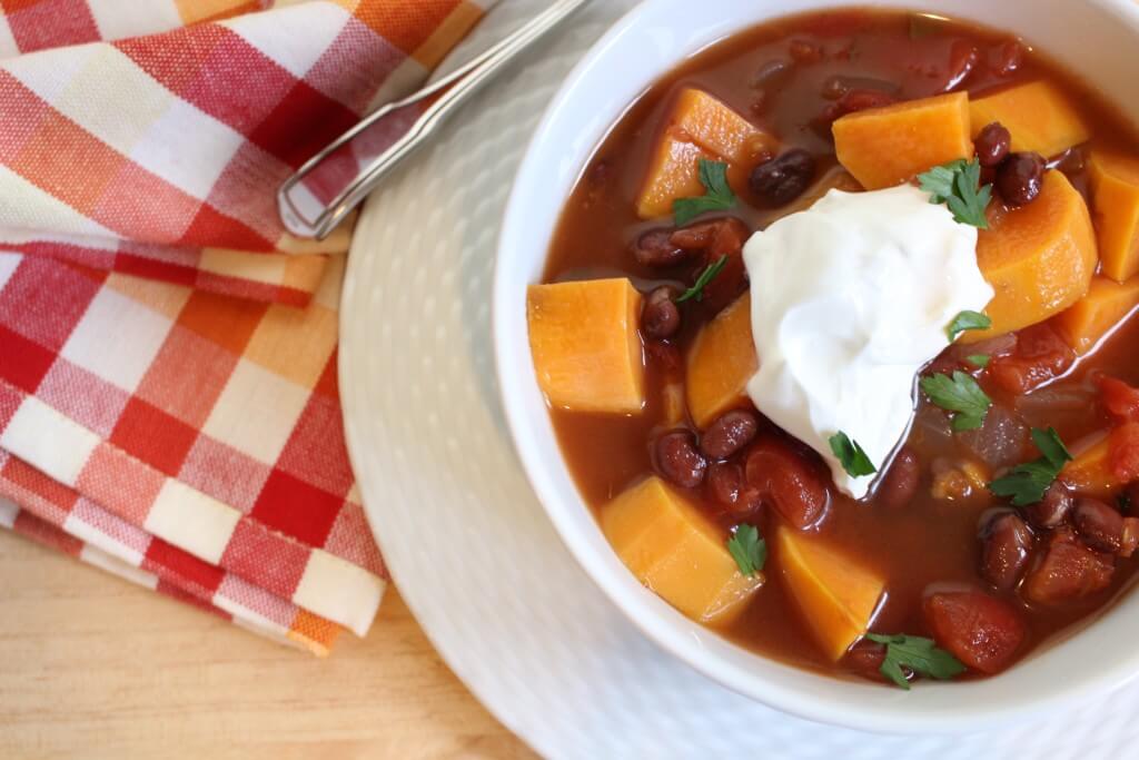 This sweet potato and black bean chili is a hearty vegetarian option perfect for a simple slow cooker dinner and easily frozen another busy weeknight meal.