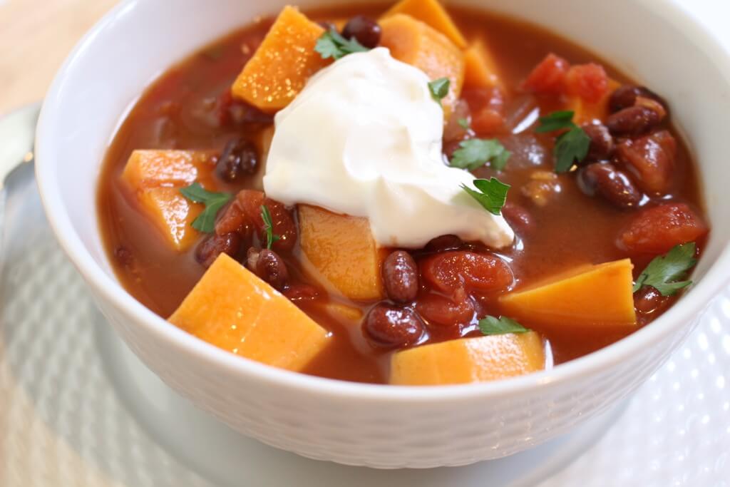This sweet potato and black bean chili is a hearty vegetarian option perfect for a simple slow cooker dinner and easily frozen another busy weeknight meal.