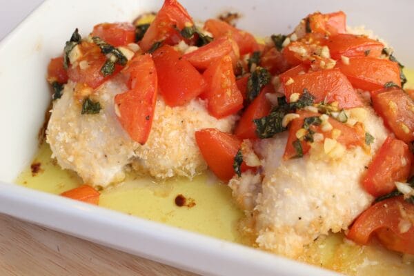 Baked bruschetta chicken breasts are lightly breaded in crunchy panko breadcrumbs and topped with the classic mixture of fresh tomatoes, basil, and garlic.