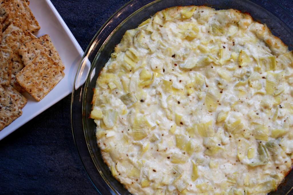 IMG_2258 - Mom to Mom Nutrition Artichoke feta dip is a savory, creamy hot appetizer perfect for any party or celebration. Serve with crackers, crusty bread, or mix in mini phyllo cups!