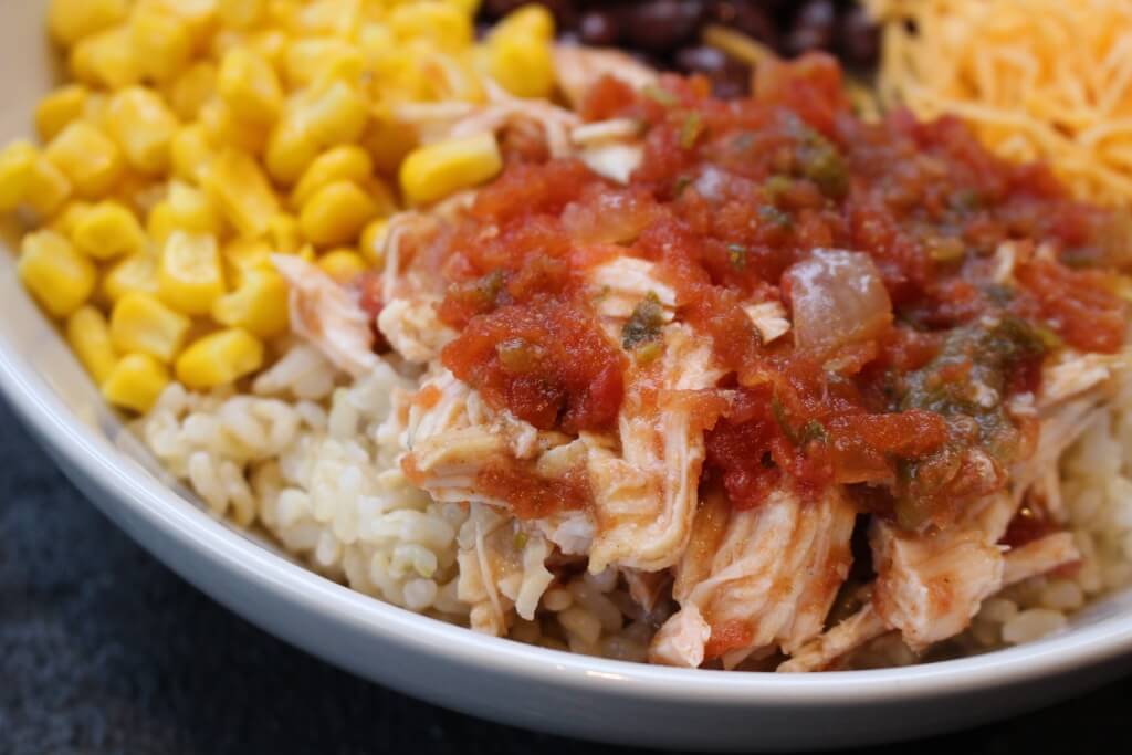 IMG_2294 - Mom to Mom Nutrition Chicken taco bowls are made with fresh taco ingredients and slow cooked chicken, and are served on a bed of brown rice for extra whole grain goodness.