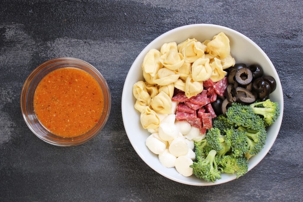 A quick and flavorful Italian pasta salad with fresh veggies, kid-friendly cheese tortellini, and prepared Italian dressing.