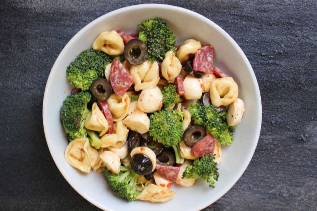 A quick and flavorful Italian pasta salad with fresh veggies, kid-friendly cheese tortellini, and prepared Italian dressing.