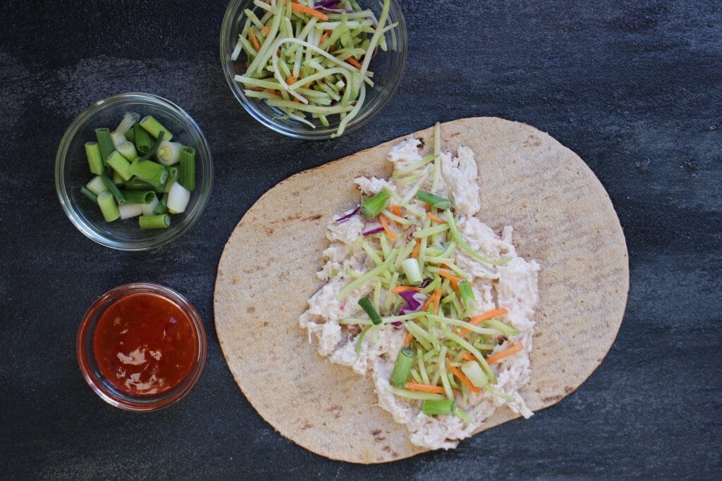 Thai Chicken Salad Wraps make a light and refreshing healthy lunch made in less than 10 minutes with precooked chicken and fiber-filled flatbread.