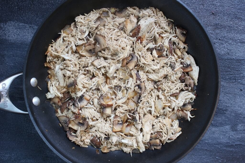 Herbed Chicken and Mushroom Skillet is a simple weeknight meal filled with earthy flavors and made kid-friendly with penne pasta and a sprinkle or two of Parmesan cheese! 