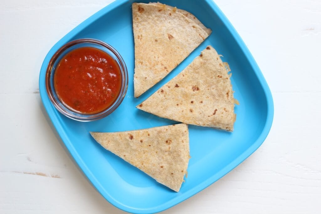 A White Bean Quesadilla makes a simple and nutritious lunch--- a serving of whole grains, dairy, and protein is the perfect mix of fuel kids and parents need to get through a busy day! 