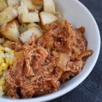 BBQ Chicken Bowls with slow cooked BBQ chicken, onions, roasted potatoes and corn make a simple make-ahead meal that are easily reheated for any busy weeknight.