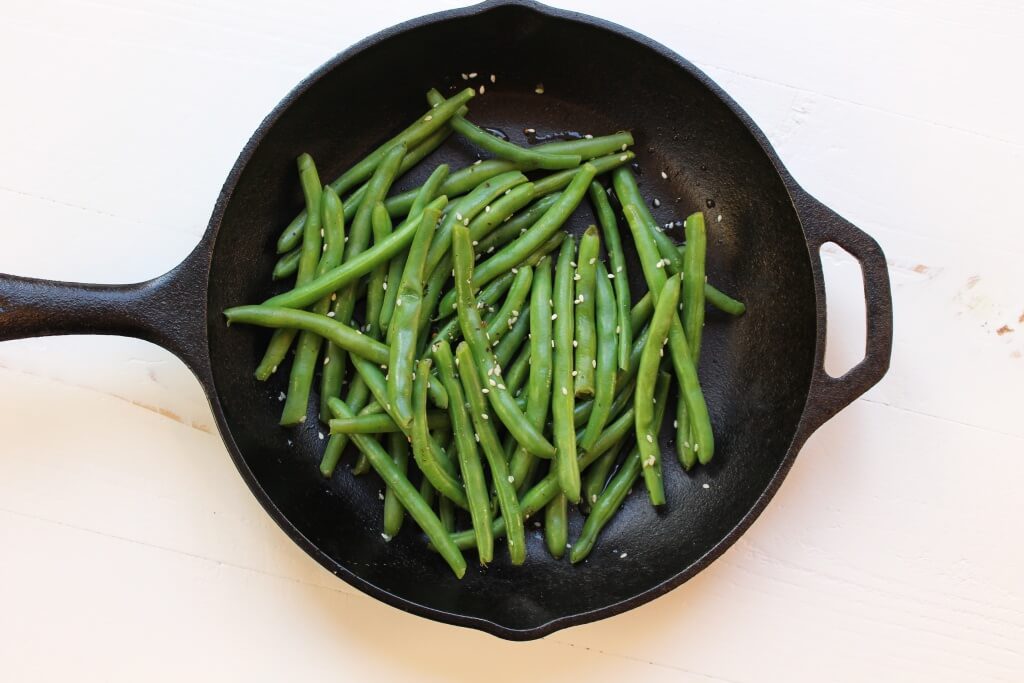 Fresh green beans are cooked with sesame seeds, soy sauce and chicken broth for a simple side dish with tons of flavor!