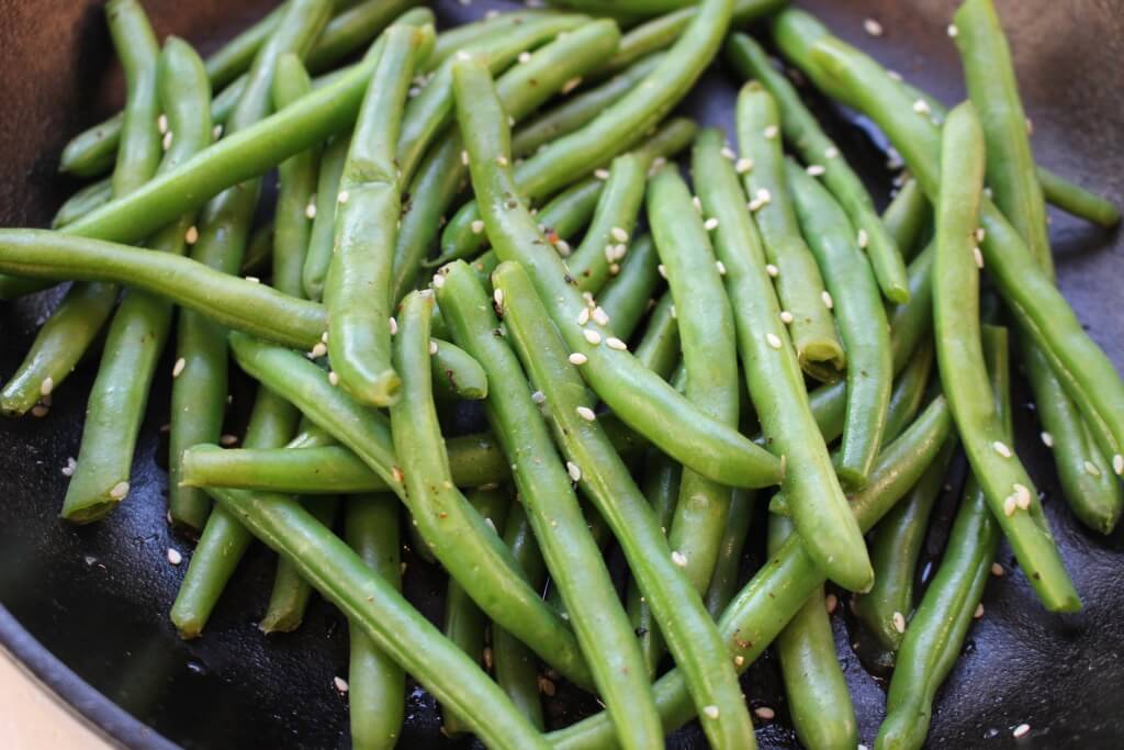 Fresh green beans are cooked with sesame seeds, soy sauce and chicken broth for a simple side dish with tons of flavor!