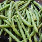 Fresh green beans are cooked with sesame seeds, soy sauce and chicken broth for a simple side dish with tons of flavor!