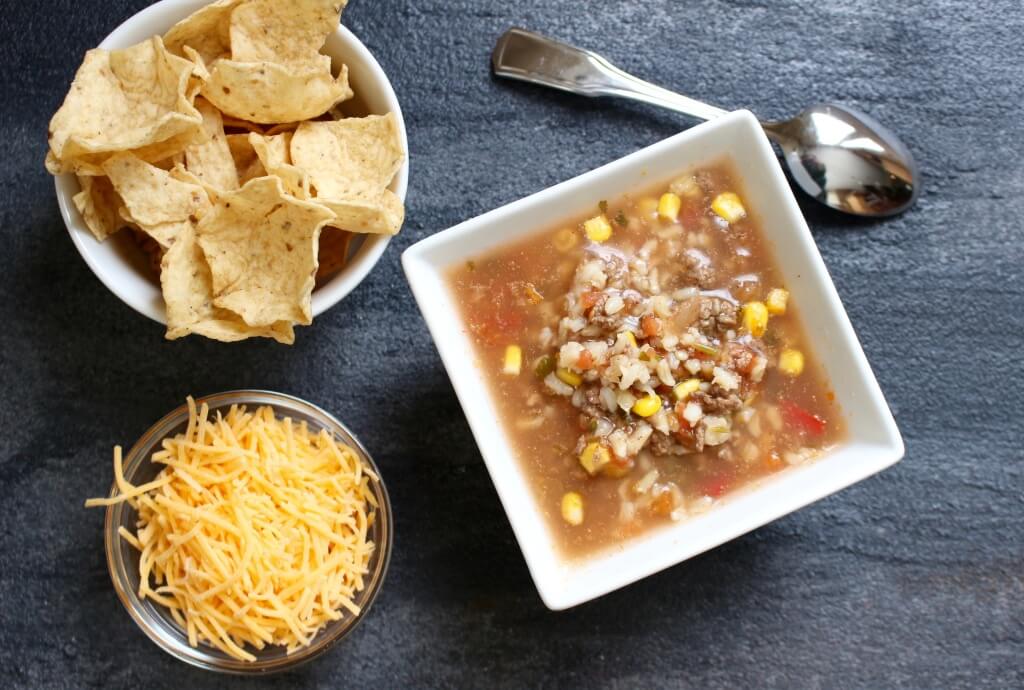 Slow Cooker Taco Soup made with veggies, salsa, and lean Ground Beef is full of traditional taco flavor but served as a soup!