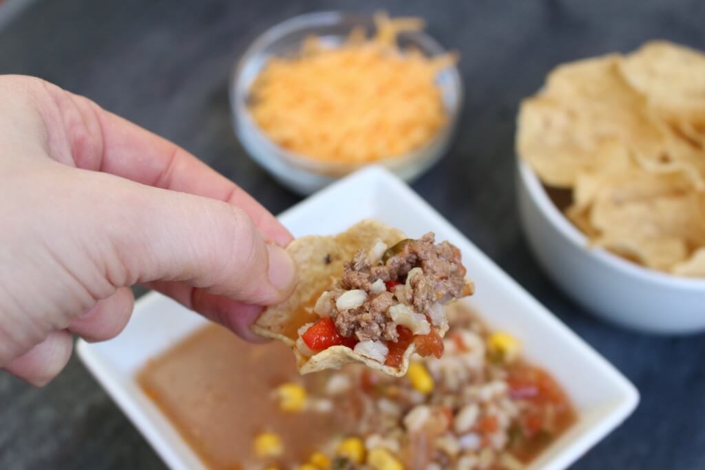 Slow Cooker Taco Soup made with veggies, salsa, and lean Ground Beef is full of traditional taco flavor but served as a soup!
