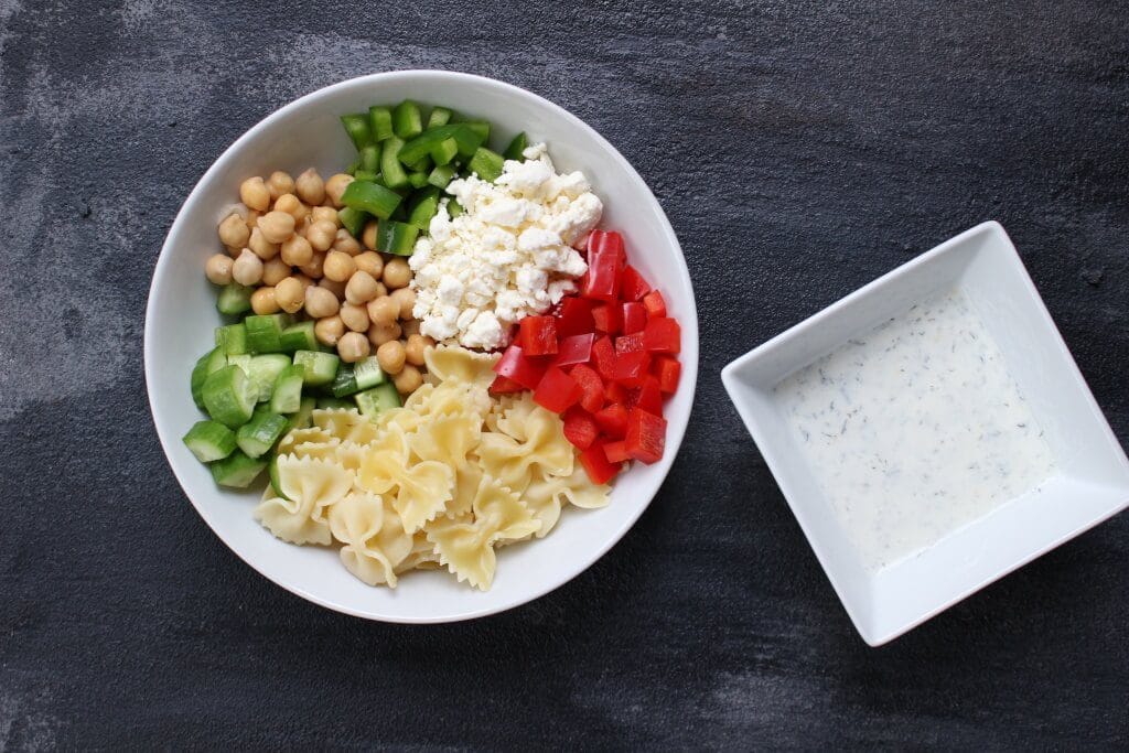 Chickpea Pasta Salad is a fresh and flavorful dish packed with protein, chopped veggies, and whole grain pasta.