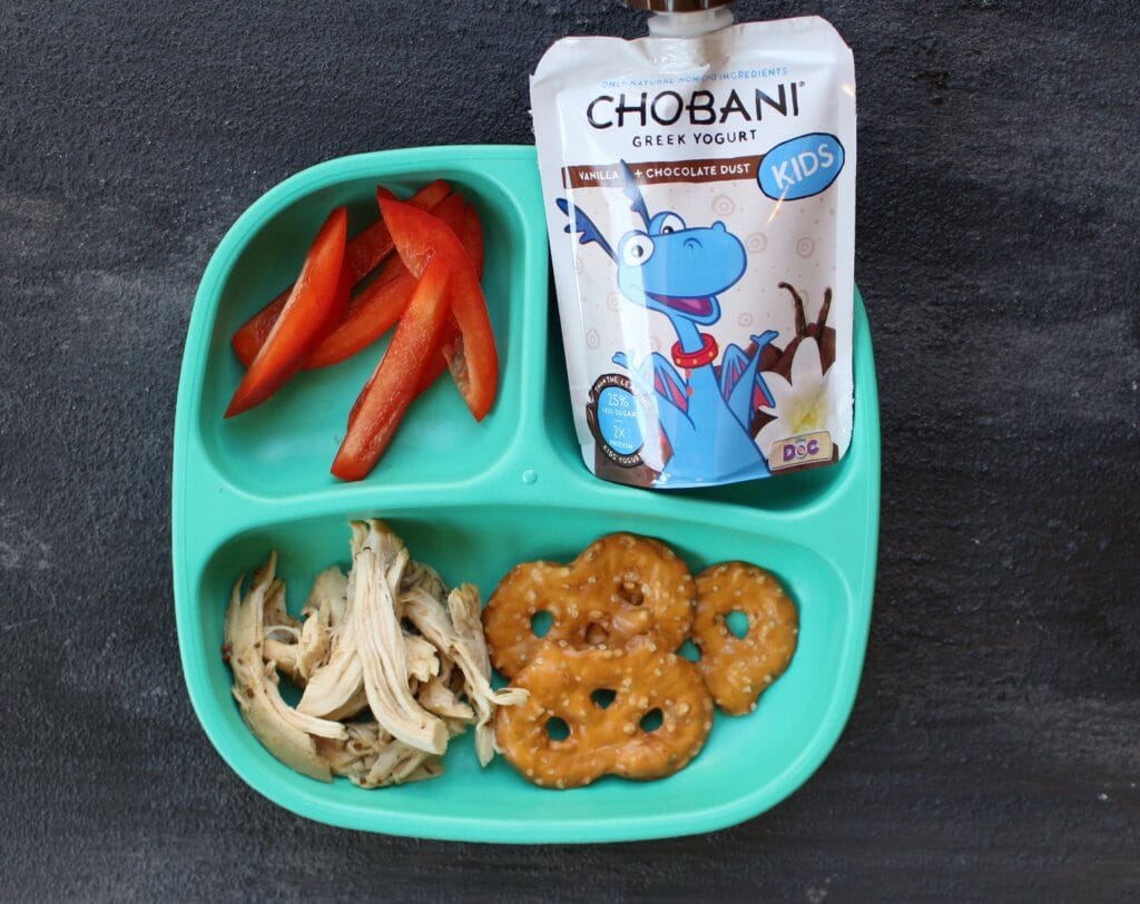 How to Get Your Toddler to Try New Foods Getting your toddler to try new foods is no easy task! But have no fear… there a few tricks you can try to open their mouths and taste buds to new textures and flavors. I didn’t realize the angst and stress that would come with feeding small children. I’ll admit I was prepared for the sleepless nights, the teething, the ear infections, etc. But food? Heck! I love food. Ted loves food. How could we create children that decide they’d like to use food as toys?! The reality is you can’t pick and choose your child’s eating habits. But I’ve quickly learned that there’s small victories in the grand scheme of feeding your picky eater. And that’s getting them to TRY new foods. Try being the keyword here… because in order to get your kids [or husband or oneself] to like a food, they’ve got to try it first! Offer favorites with new foods. This trick is KEY for my boys. And usually [typing while knocking on wood] works when I give them their ultimate favorite food: yogurt! So IF there’s a new food that I’d like them to pick up, sniff, and possibly put to their mouths, I give them their favorite “side” as the familiar food on their plate. Our go-to yogurt for the “familiar trick” is Chobani Tots Greek yogurt pouches. If the boys decide to skip trying the newbie, I’m comforted knowing they are getting a good source of protein and calcium with a little sweetness to satisfy their hunger. Another bonus: these pouches and their flavors are made without artificial sweeteners or preservatives. Something every person or parent can feel good about! Vary your child’s favorite foods. What I really mean by this strategy is not to serve the same food twice in one day, or two days in a row. I “stole” this tip from a feeding expert and it’s worked out well for us. While it might seem like you need to have all kinds of foods stocked in your fridge or pantry, well, you are right. That’s doesn’t mean you have to buy a lot of everything though. A green bell pepper in toddler serving size can last a few days. But once you try this strategy for a week or two you’ll get into a rhythm and routine when it comes to buying those groceries. You can follow my weekly food prep [including these “new foods” on Instagram!]. Model healthy eating behavior for your children. Because I’m not much of a breakfast eater and my boys aren’t much of dinner eaters, I find the best time for me to model healthy eating behavior is during snack time and lunch. From fresh fruits and vegetables to grilled sandwiches and melts, I’m always trying to change up our lunch and snack routine with new, healthy foods. And that includes new flavors and textures in our favorites, like Chobani Tots Greek yogurt AND the many varieties in their classic product line. With 25% less sugar and twice as much protein than other kids’ yogurts, I don’t mind the scuffle that ensues when the boys basically fight over who gets the last box of pouches! Let them get hungry. This is a hard one. Because sometimes it’s just easy giving your kids something to munch on while you cook dinner or when you are at the doctor or church to prevent a meltdown. But if you can find another alternative [yes, we turn on the TV BEFORE dinner so prevents pantry perusing] then try to hold them off. A hungrier toddler is more likely to try new foods! Start small with new textures and flavors. Here’s an example that recently worked with Joey: While he gobbles up the Chobani Kids Greek yogurt Apple flavor, he’s not much of a fan of the raw deal, meaning a raw apple with skin ON. Realizing his love for this yogurt flavor and a little crunch in yogurt parfait’s… I decided to combine the two! I chopped up a green apple, added it to the yogurt + some granola, and voila! He had an apple yogurt parfait. We shared the parfait together… and of course little bro gobbled it up. But the moral of this story [or tip] is to start small with new flavors and textures--- and perhaps serve it in a way that’s new and exciting--- or familiar, like in my first tip! So there you have it! Some tips and tricks that have helped expand my toddler’s palates beyond just Goldfish. Seriously… they could live off those things! Since this isn’t my first rodeo feeding toddlers, I have a few other resources that might interest you: Tell me: What strategies do you use at home to get your toddlers [or any child] to try new foods?!