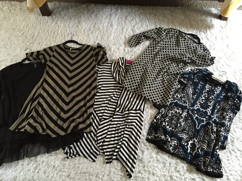 Note: I took a picture of these clothes for a friend who needed to borrow a few maternity tops. Black is slimming on pregnant women and clearly I'm going for that this time around... 