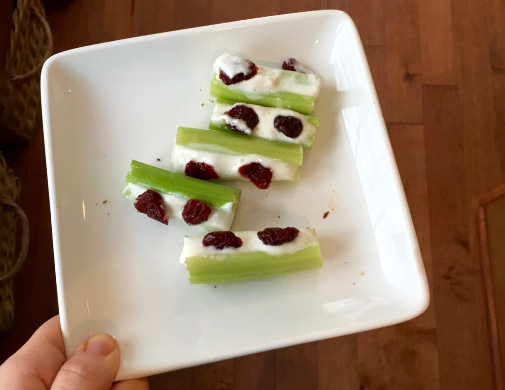 How to Get Your Toddler to Try New Foods Getting your toddler to try new foods is no easy task! But have no fear… there a few tricks you can try to open their mouths and taste buds to new textures and flavors. I didn’t realize the angst and stress that would come with feeding small children. I’ll admit I was prepared for the sleepless nights, the teething, the ear infections, etc. But food? Heck! I love food. Ted loves food. How could we create children that decide they’d like to use food as toys?! The reality is you can’t pick and choose your child’s eating habits. But I’ve quickly learned that there’s small victories in the grand scheme of feeding your picky eater. And that’s getting them to TRY new foods. Try being the keyword here… because in order to get your kids [or husband or oneself] to like a food, they’ve got to try it first! Offer favorites with new foods. This trick is KEY for my boys. And usually [typing while knocking on wood] works when I give them their ultimate favorite food: yogurt! So IF there’s a new food that I’d like them to pick up, sniff, and possibly put to their mouths, I give them their favorite “side” as the familiar food on their plate. Our go-to yogurt for the “familiar trick” is Chobani Tots Greek yogurt pouches. If the boys decide to skip trying the newbie, I’m comforted knowing they are getting a good source of protein and calcium with a little sweetness to satisfy their hunger. Another bonus: these pouches and their flavors are made without artificial sweeteners or preservatives. Something every person or parent can feel good about! Vary your child’s favorite foods. What I really mean by this strategy is not to serve the same food twice in one day, or two days in a row. I “stole” this tip from a feeding expert and it’s worked out well for us. While it might seem like you need to have all kinds of foods stocked in your fridge or pantry, well, you are right. That’s doesn’t mean you have to buy a lot of everything though. A green bell pepper in toddler serving size can last a few days. But once you try this strategy for a week or two you’ll get into a rhythm and routine when it comes to buying those groceries. You can follow my weekly food prep [including these “new foods” on Instagram!]. Model healthy eating behavior for your children. Because I’m not much of a breakfast eater and my boys aren’t much of dinner eaters, I find the best time for me to model healthy eating behavior is during snack time and lunch. From fresh fruits and vegetables to grilled sandwiches and melts, I’m always trying to change up our lunch and snack routine with new, healthy foods. And that includes new flavors and textures in our favorites, like Chobani Tots Greek yogurt AND the many varieties in their classic product line. With 25% less sugar and twice as much protein than other kids’ yogurts, I don’t mind the scuffle that ensues when the boys basically fight over who gets the last box of pouches! Let them get hungry. This is a hard one. Because sometimes it’s just easy giving your kids something to munch on while you cook dinner or when you are at the doctor or church to prevent a meltdown. But if you can find another alternative [yes, we turn on the TV BEFORE dinner so prevents pantry perusing] then try to hold them off. A hungrier toddler is more likely to try new foods! Start small with new textures and flavors. Here’s an example that recently worked with Joey: While he gobbles up the Chobani Kids Greek yogurt Apple flavor, he’s not much of a fan of the raw deal, meaning a raw apple with skin ON. Realizing his love for this yogurt flavor and a little crunch in yogurt parfait’s… I decided to combine the two! I chopped up a green apple, added it to the yogurt + some granola, and voila! He had an apple yogurt parfait. We shared the parfait together… and of course little bro gobbled it up. But the moral of this story [or tip] is to start small with new flavors and textures--- and perhaps serve it in a way that’s new and exciting--- or familiar, like in my first tip! So there you have it! Some tips and tricks that have helped expand my toddler’s palates beyond just Goldfish. Seriously… they could live off those things! Since this isn’t my first rodeo feeding toddlers, I have a few other resources that might interest you: Tell me: What strategies do you use at home to get your toddlers [or any child] to try new foods?!