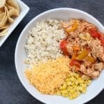 Slow cooker chicken enchilada bowls are the easy AND healthy way to make enchiladas. Without all the rolling that comes with traditional Mexican-inspired dish!