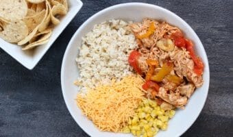 Slow cooker chicken enchilada bowls are the easy AND healthy way to make enchiladas. Without all the rolling that comes with traditional Mexican-inspired dish!