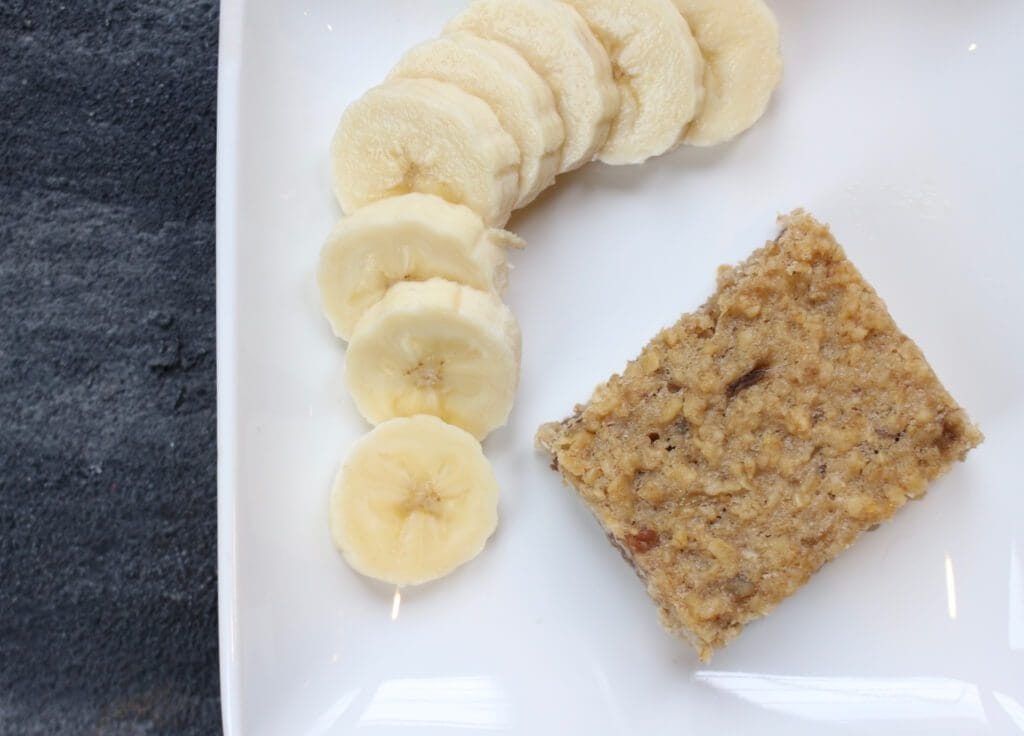 IMG_2877 - Mom to Mom Nutrition Banana breakfast bars make a quick and easy breakfast or afternoon snack and are baked to perfection with simple ingredients like yogurt, oats, and bananas.