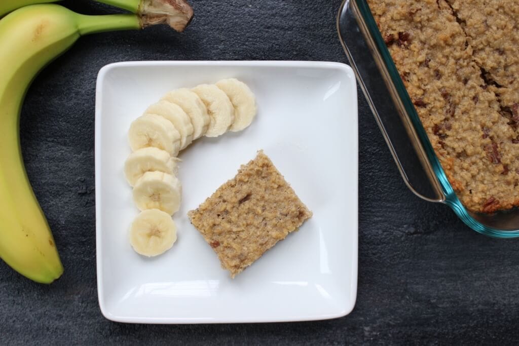 IMG_2880 - Mom to Mom Nutrition Banana breakfast bars make a quick and easy breakfast or afternoon snack and are baked to perfection with simple ingredients like yogurt, oats, and bananas.