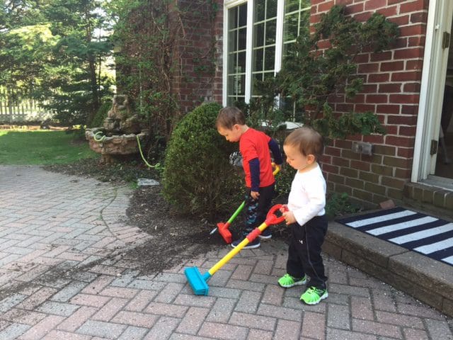 Give them matching brooms and they take interest in cleaning too. Who would've guessed it?!