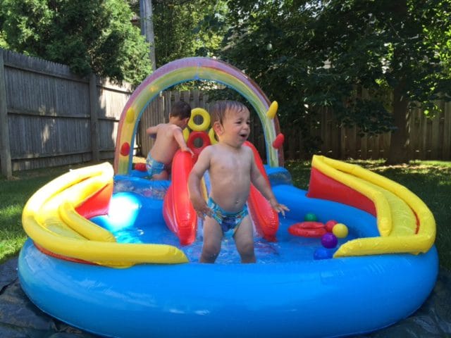 We might not have a pool membership just yet but we've got something just as good in a toddler's mind: a big blow-up slide pool thingy! I have no idea what the actual name of this contraption is... all I know is it holds a lot of water and toys! 