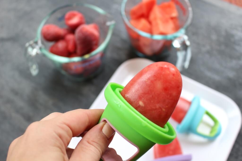 These watermelon popsicles are made with fresh and frozen fruit and zero added sugar, making the perfect healthy refreshing treat for any hot summer day! I don’t know what it is about watermelon and being pregnant, but some crazy watermelon craving comes over me when I’ve got a baby in my uterus. And since that’s been the case the past three years, you better believe I’ve consumed enough watermelon to feed a small army. Summer or not, my boys have always gravitated towards the sweet, water-filled fruit as well. So when the idea for these watermelon popsicles came to mind I knew that if I perfected my recipe, we’d be enjoying watermelon popsicles for years to come! I wasn’t sure if I needed to do a formal post for these watermelon popsicles as I already shared the how-to for them on Instagram and in my recent 10 Homemade Popsicles for Summer blog post. But since I’m practically dreaming and bathing in watermelon right now [c/o my 36th week of pregnancy], I figured why not talk about them some more! While we are happy campers just snacking on a bowl filled with sliced watermelon, there’s something to be said about using it in other recipes. Like all fruit, watermelon is naturally sweet and makes a great dessert or snack. Next time you want to serve up a kid-pleasing and healthy dish, think watermelon! Side note: Watermelon is 92% water--- making it a delicious hydrator. Chances are that’s why pregnant women and