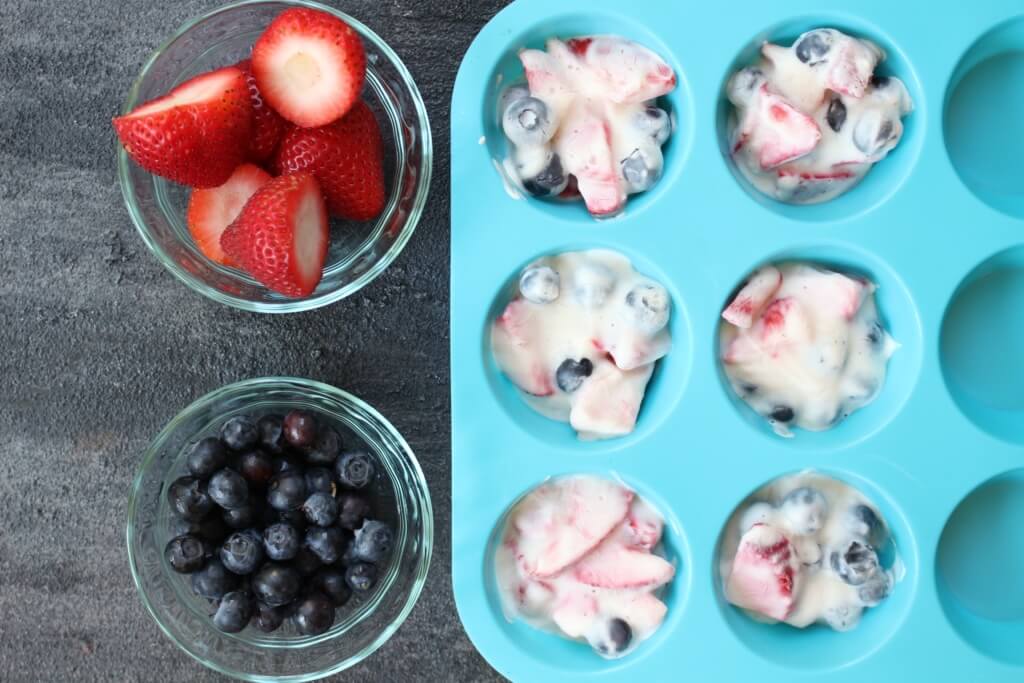 Frozen yogurt fruit cups are a fun cup-sized Greek yogurt and fruit snack that make a great alternative frozen sweet treat to popsicles or ice cream!