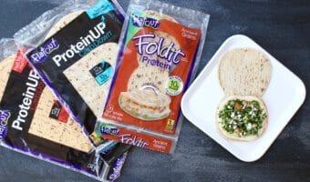 Chickpeas, quinoa, and whole grains make protein-packed hummus wraps the ideal lunch for those looking to get adequate amounts of plant protein at mealtime.