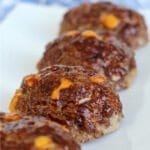 These kid-sized barbecue cheddar mini meatloaves are flavored with barbecue sauce and studded with yummy cheddar cheese.