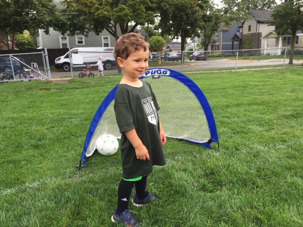 First week of soccer practice Joey just sort of looked around and watched the other kids. What happened the second week? He was out there kicking and running too! My little man just had to take it all in in the beginning...