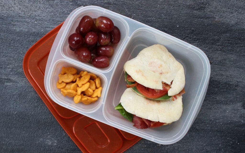 BLT Pita Pockets pack a punch of flavor for a quick and easy classic bacon, lettuce, and tomato sandwich with a simple hummus spread. Great for a quick school or work lunch!