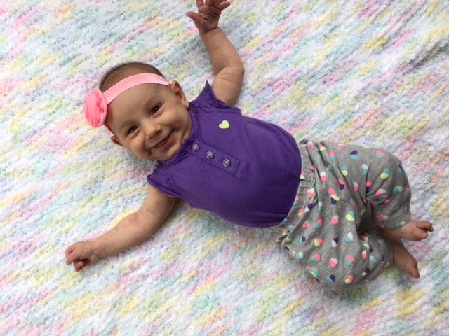 Here's Lily, two months old, smirking at Momma because she knows EXACTLY what she's doing when it comes to her and that bottle! She's lucky she's cute and Mom lets her get away with it! 