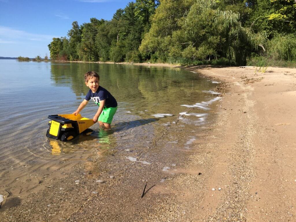 Joey's happy place includes water and his dump truck!