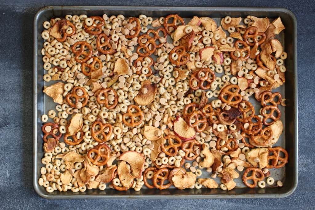 Combine the flavors of fall with this simple, crunchy apple peanut butter Cheerios snack mix. Made with Honey Nut Cheerios, dried apple chips, and peanut butter chips!