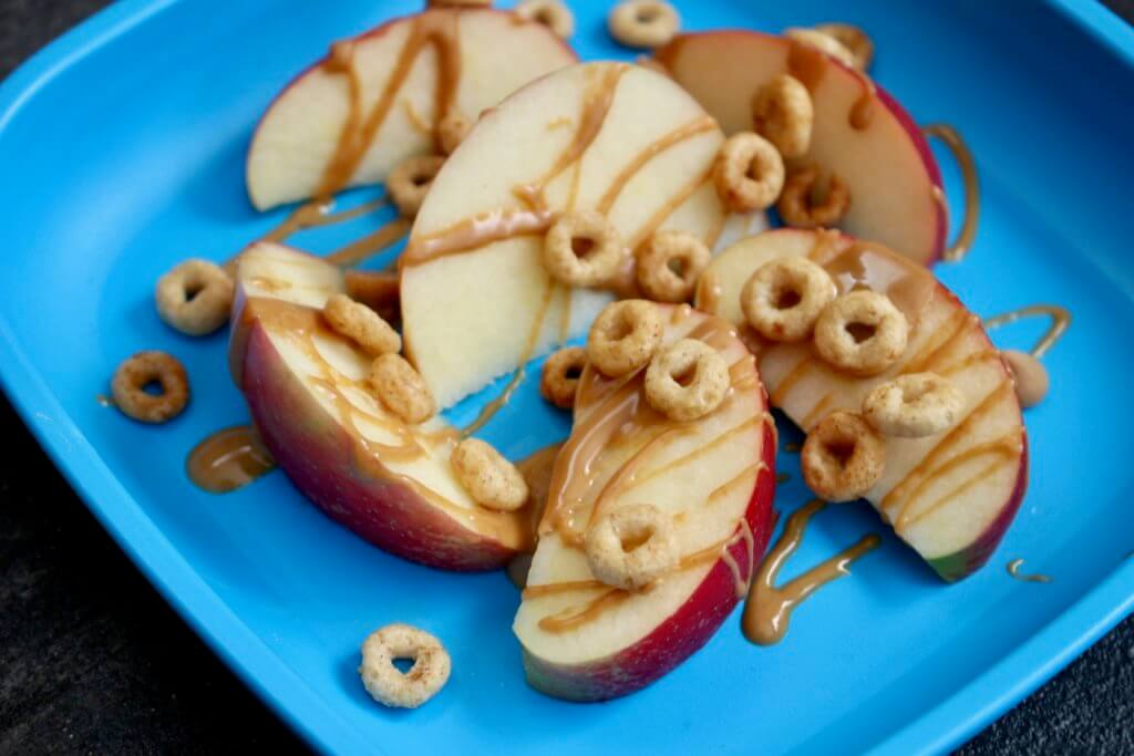 Combine the flavors of fall with this simple, crunchy apple peanut butter Cheerios snack mix. Made with Honey Nut Cheerios, dried apple chips, and peanut butter chips!