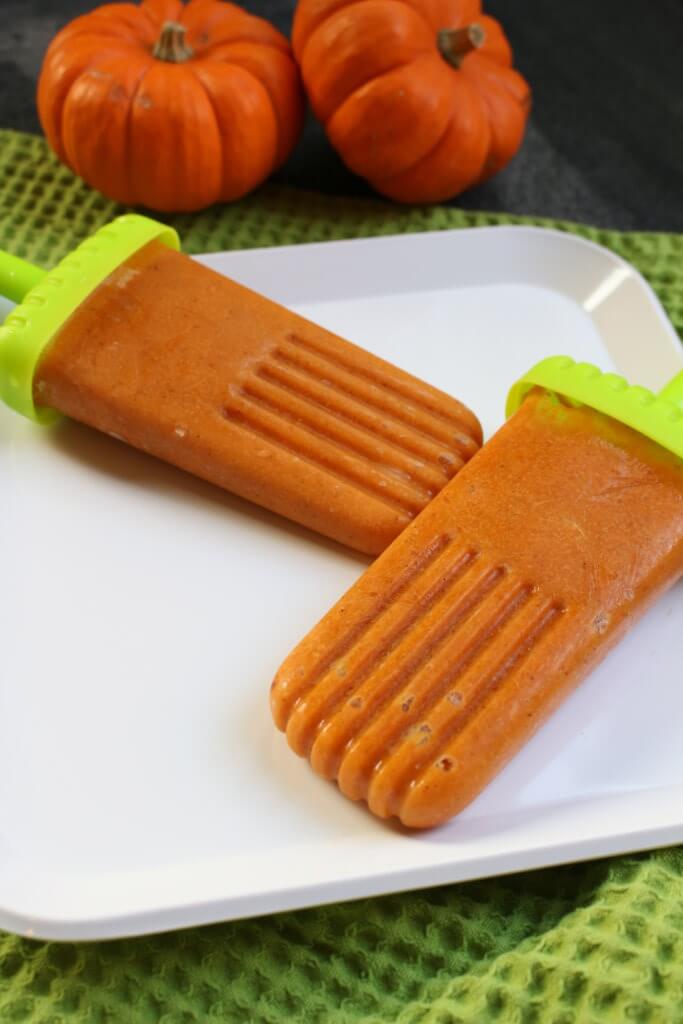 Pumpkin spice popsicles are made with a creamy combination of canned pumpkin, Greek yogurt, and all the flavors and spices of fall!