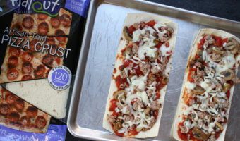 Flatbread pizza crust is topped with a homemade pizza sauce and a hearty combination of sausage, mushrooms, and onions! Making pizza night light and flavorful!