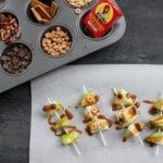 Caramel apple pops are an easy and delicious way to eat a traditional caramel apple. Get the kids involved in topping their own with dried cereal, chocolate chips, or extra caramel sauce!
