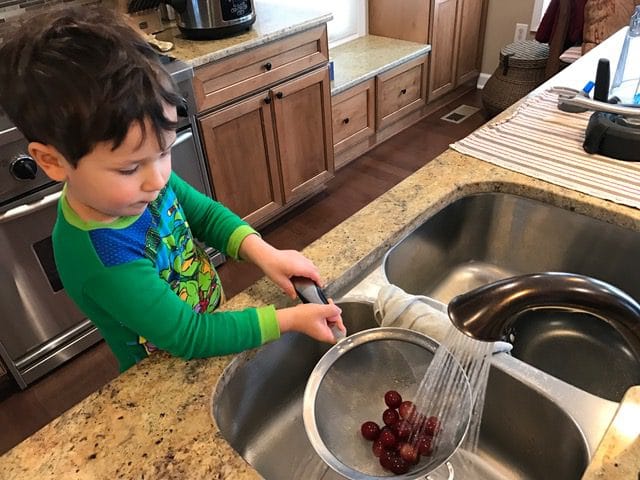 IMG_8511 - Mom to Mom Nutrition From unloading groceries, washing produce or grating cheese, here are 8 fun and interactive ways toddlers can help in the kitchen.