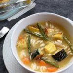 Cook once and dine twice with a big batch of roasted vegetables. And make the most of the leftovers by adding them to a simple chicken soup!