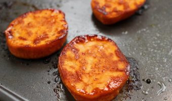 Roasted sweet potato rounds make a simple, healthy side dish or perfect first food for your baby. Just slice, roast, and enjoy!