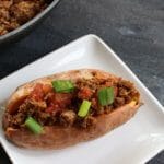 Taco stuffed sweet potatoes combine your favorite taco toppings with a nutritious sweet potato as a healthy base! Make this meal even quicker by cooking the sweet potatoes ahead of time. When it comes to weekly meal planning, we almost always have a taco-esc themed dinner night. So, whether that’s oven baked tacos, taco salads, or taco stuffed sweet potatoes, I’m bringing out the lean Ground Beef, some taco seasoning, and lots of cheese. Because the boys will demand cheese melted on a mini-tortilla when they realize it’s taco night! If you haven’t already guessed it, these taco stuffed sweet potatoes were thoroughly enjoyed by Ted and I. The boys? Eh. Like I said, they wanted cheese melted on a tortilla [in the microwave--- so gourmet!]. Anthony had some of the beef and a few bites of my sweet potato. Joey? He definitely had his fair share of melted cheese. That doesn’t mean your two or three-year-old won’t like taco stuffed sweet potatoes. I’m just giving you a heads-up to have some tortillas on hand for those that want carbs from a tortilla vs. a sweet potato. Can you blame them?!